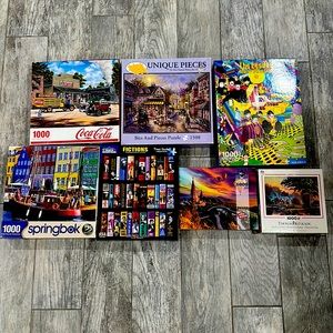 Bundle of 7 jigsaw puzzles.